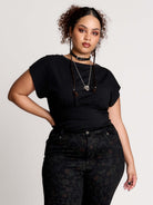  short sleeve top with a softly draped silhouette and a flattering, cinched waist. 