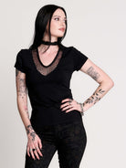 a black short-sleeve V-neck t-shirt featuring a sheer polka-dot mesh panel at the neckline