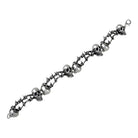 Silver bracelet with skull and barbed wire designs.