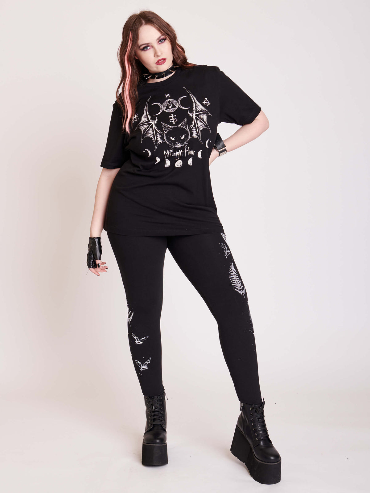 Witchy broom stick graphic on black leggings