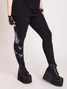 Witchy broom stick graphic on black leggings