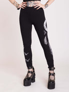 Witchy broom stick graphic on black leggings
